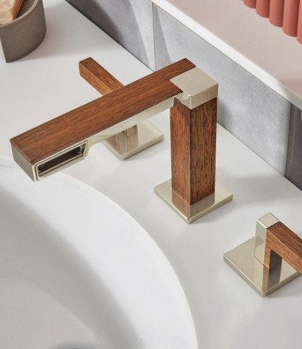 The Widespread Deck-Mount Lavatory Faucet from the Frank Lloyd Wright® Bath Collection by Brizo®, mounted on a white countertop.