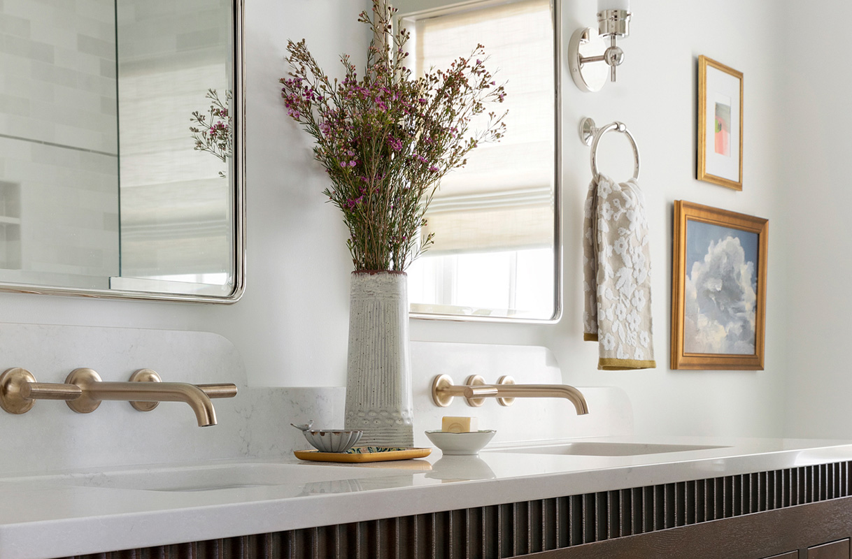 Interior Designer: JKath Design Build + Reinvent / Edina, Minnesota, 2022 / photographer: Spacecrafting Photography / featuring the odin® widespread Lavatory Faucet with lever handles in Brilliance® Luxe Gold®.