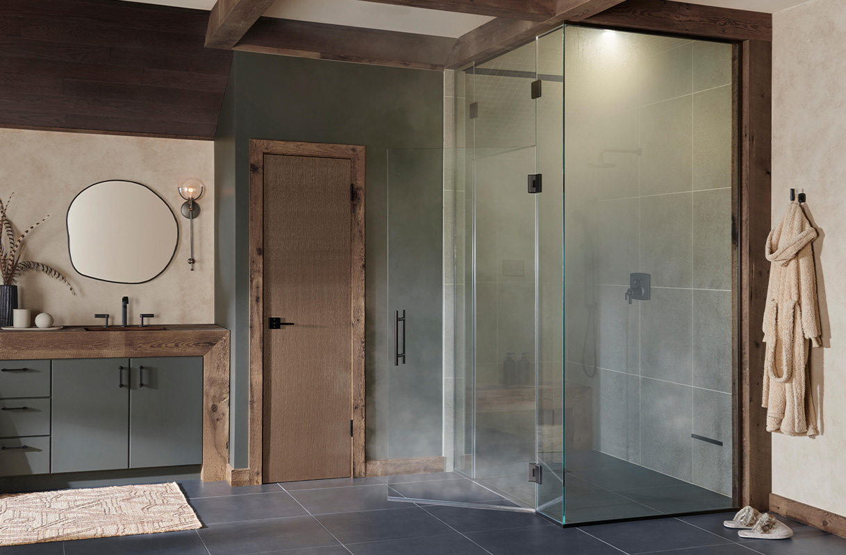 Featuring the Allaria™ Widespread Lavatory Faucet, TempAssure® Thermostatic Custom Shower with Integrated Diverter, Mystix™ Steam System Transcendent Experience, and Coordinating Accessories in Matte Black